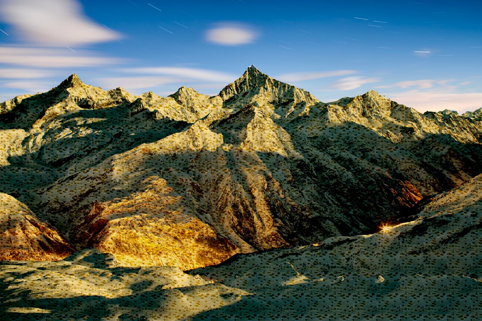 an image of a mountain range at night